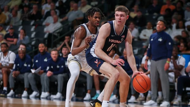 Virginia Cavaliers guard Isaac McKneely (11) is defended by Georgia Tech Yellow Jackets guard Miles Kelly (13) in the second half at McCamish Pavilion.